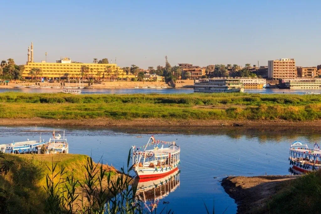 Tourist boats moored near the shore of the Nile River, Luxor