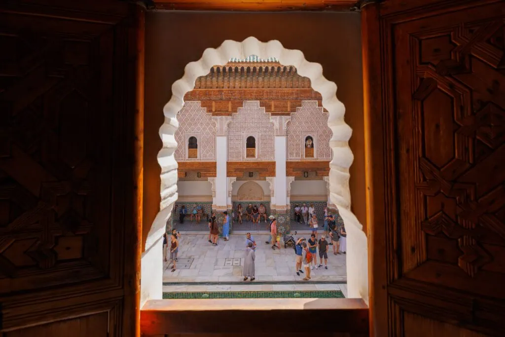 Scenic view of tourists visiting Madrasa Ben Youssef mosque in the Old Town Medina area of Marrakech, west Morocco