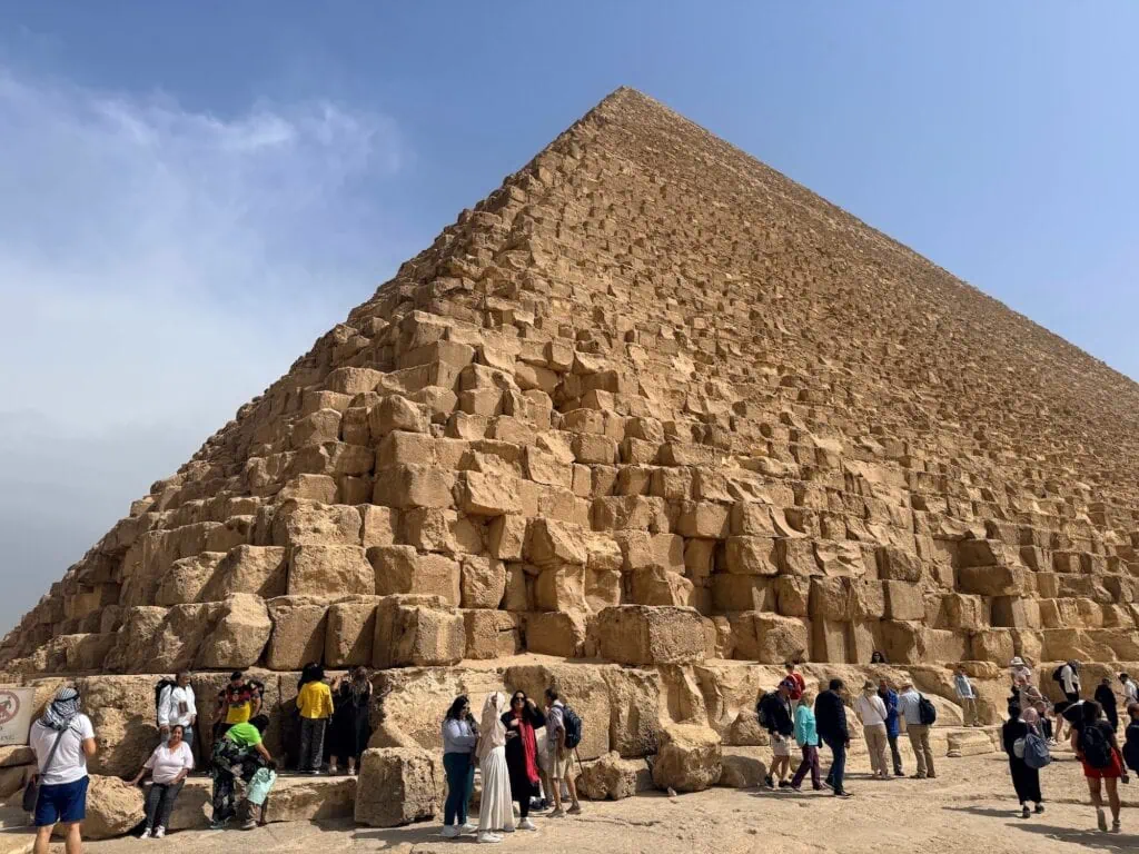 Great Pyramid of Khufu with limestone blocks and triangular silhouette rising from the Giza Plateau, Giza